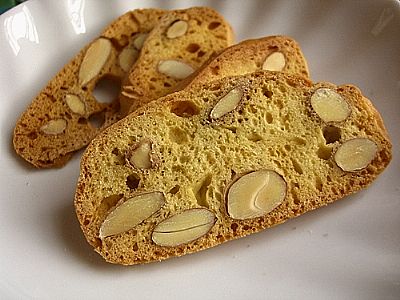 Three pieces of almond biscotti on white plate