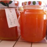 Two jars full of orange coloured jam with labels. food ideas