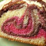 A cut side of three coloured marble cake.