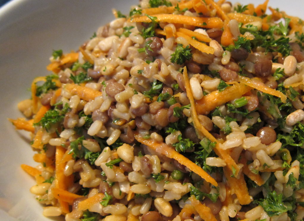 Brown rice , lentil, carrot and parsley salad close up