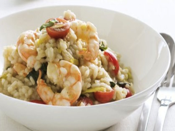 chicken and prawn risotto bowl with cherry tomatoes