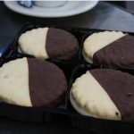 Four round chocolate covered tarts