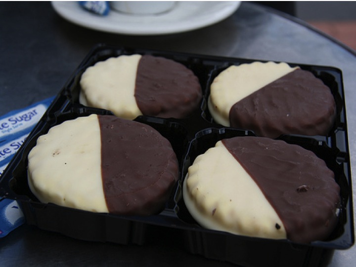 Four round chocolate covered tarts