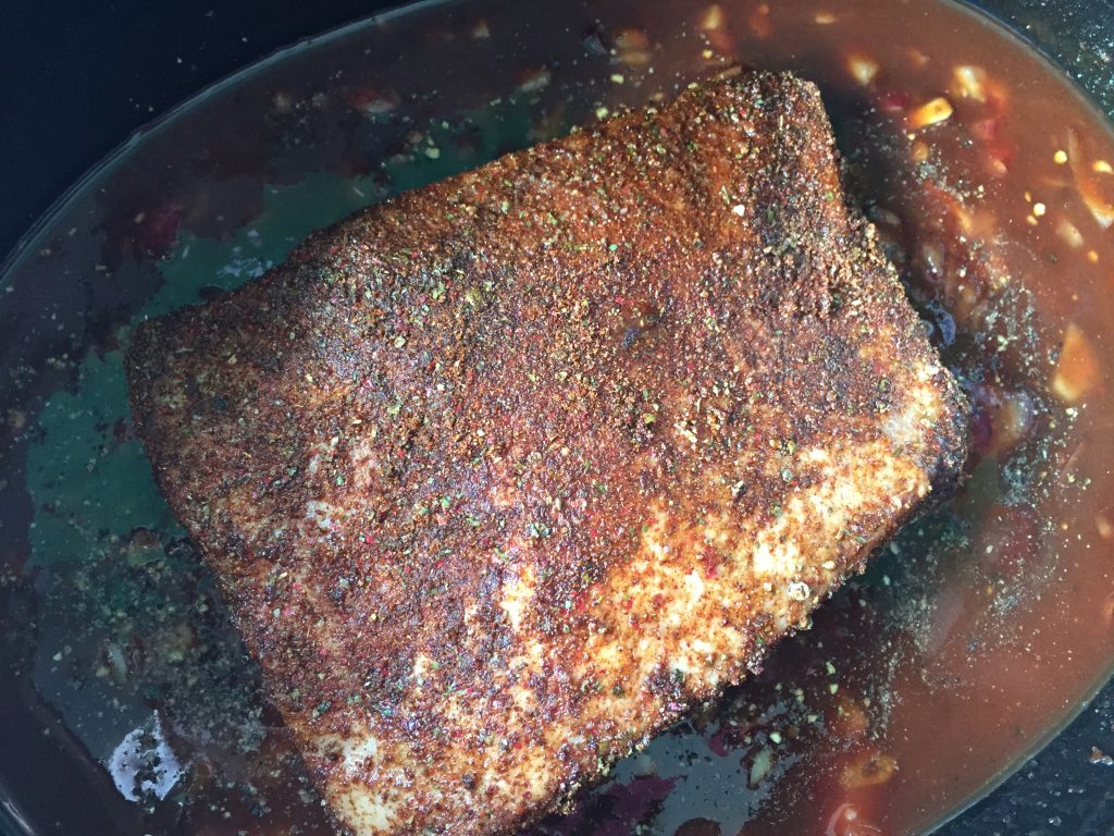 Slow cooked beef brisket covered in spice rub