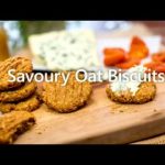 Oat biscuits and cheese on a wooden board, and text across the image.