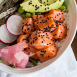 Easy to make salmon poke bowl with ginger, radish, and avocado