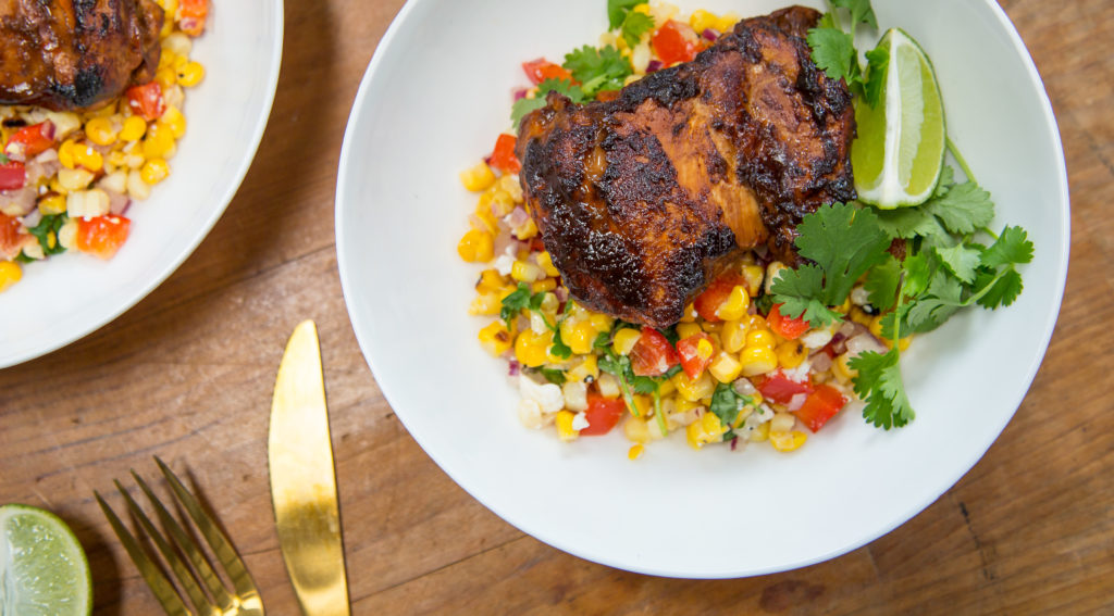 Chipotle Coffee Chicken with charred corn salsa on a plate