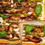Bacon, asparagus and feta cheese rectangle open top pie, cut piece separated a little.