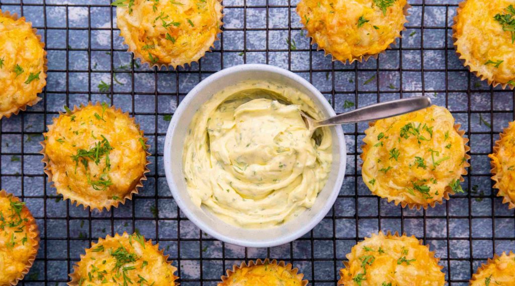 pot of soft dill butter and muffins on a wire rack