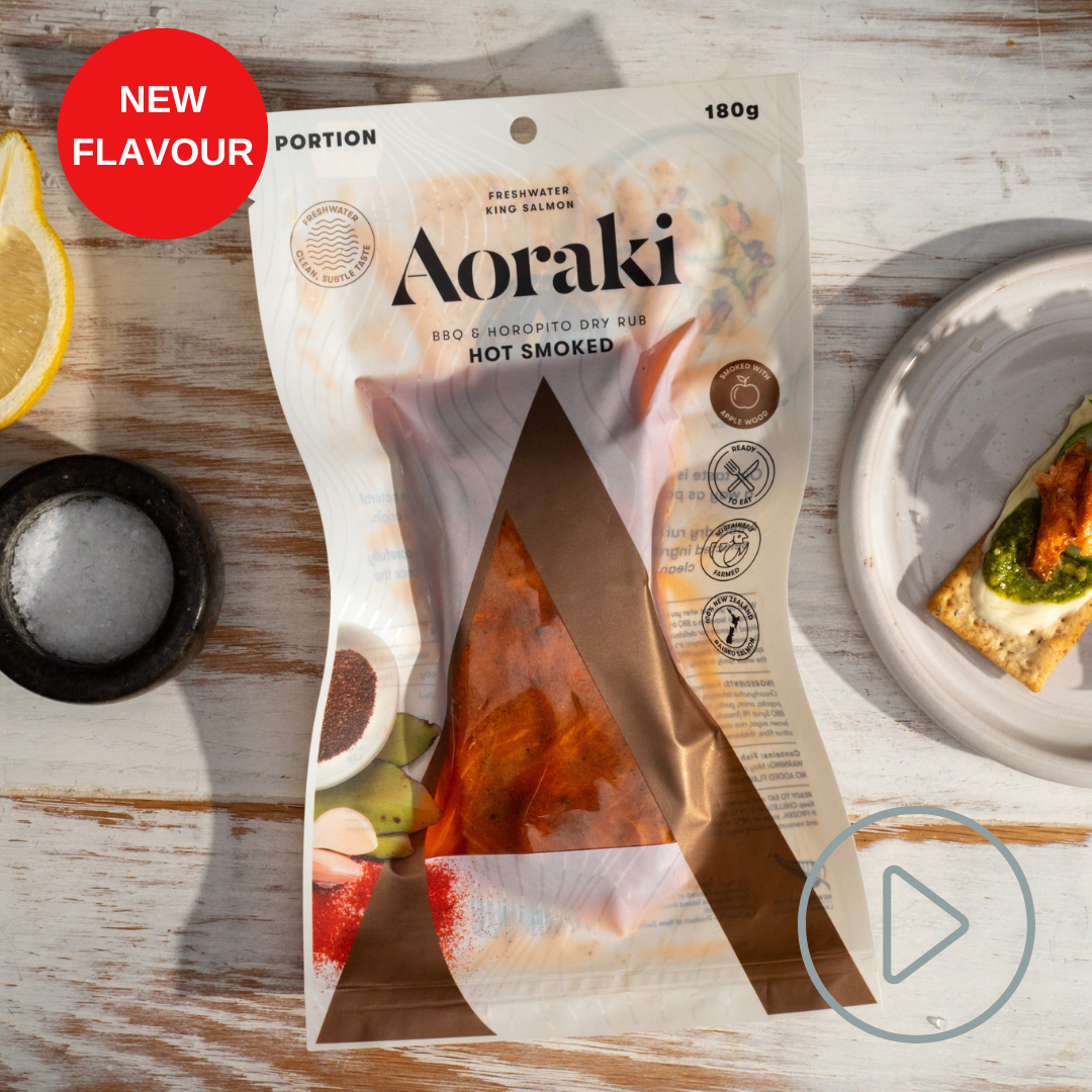 Package of Aoraki BBQ and Horopito Dry Rub Hot Smoked Salmon with a red NEW button in the corner and a play button link