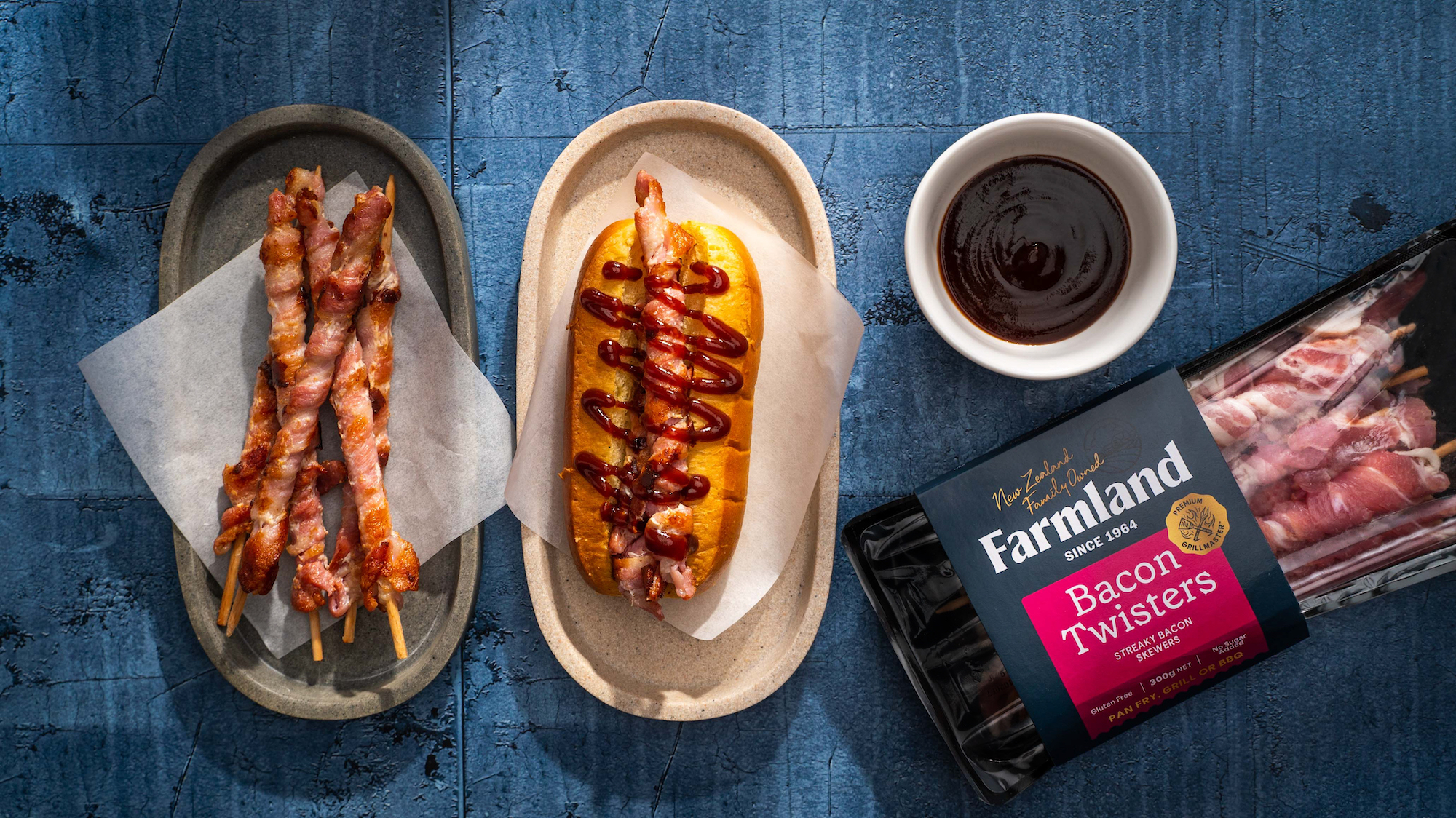 May must-haves 2023 - Farmland bacon twisters shown in the packet, cooked on a plate, and in a bread roll on a plate with a small dish of sauce