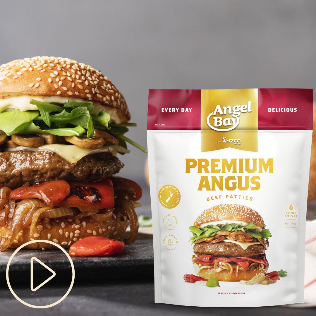 A tall hamburger with a packet of Angel Bay Premium Beef burger patties. Play button in corner of image.