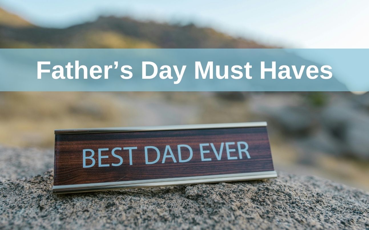 Father's Day Must Haves banner on an image ofa some bush with a sign saying best dad ever sitting on a rock in the foreground