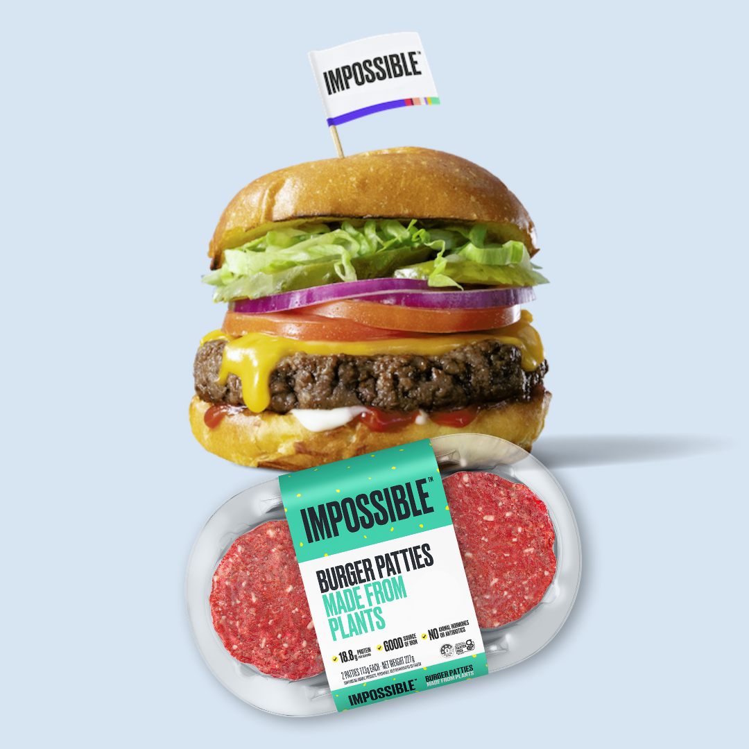 A hamburger with a packet of Impossible Foods plant based hamburger patties