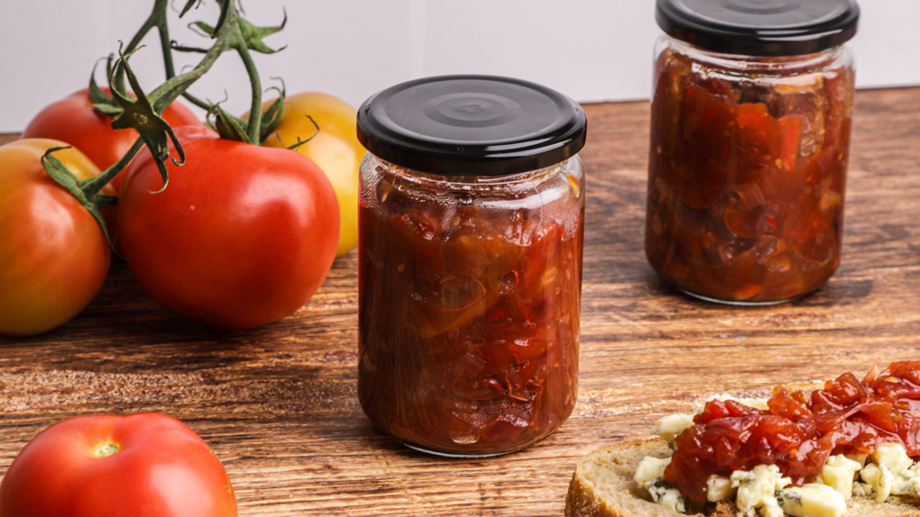 Tomato chutney jars with fresh vine tomatoes and bruschetta