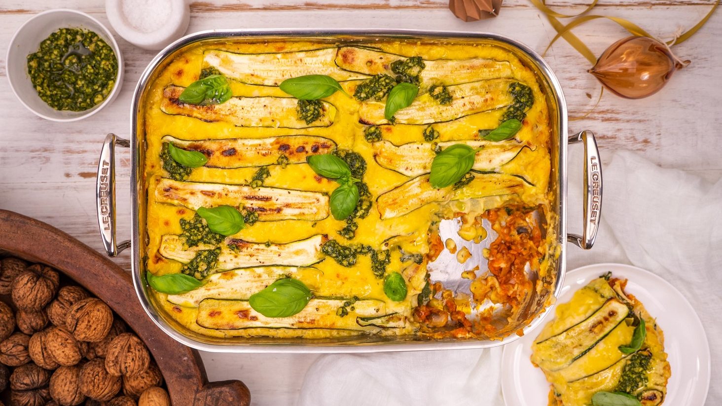 Vegan lasagne tray with a slice on the side